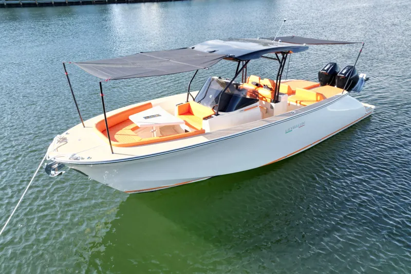  Yacht Photos Pics 2026 Lilybaeum Lipari 31 boat with orange seating, anchored on calm water.