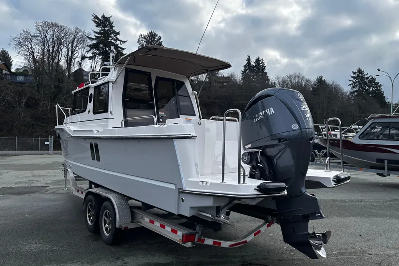  Yacht Photos Pics 2026 Ranger Tugs R-25 boat on trailer with Yamaha outboard motor.