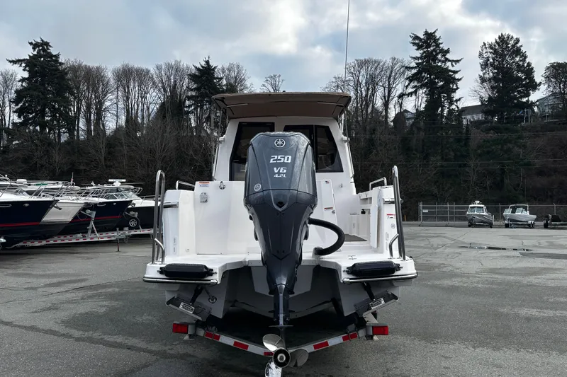  Yacht Photos Pics 2026 Ranger Tugs R-25 boat with Yamaha 250 V6 engine, parked outdoors.