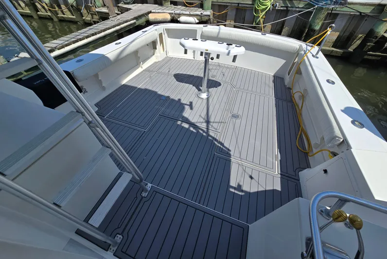  Yacht Photos Pics Spacious deck of 1998 Henriques 38 Sportfisherman, featuring clean, modern design and ample seating.