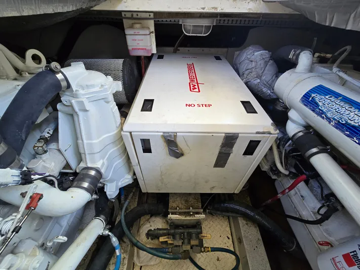  Yacht Photos Pics Engine room of a 1998 Henriques 38 Sportfisherman with visible machinery and components.