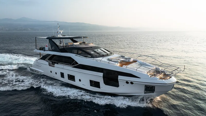 Chillin' Yacht Photos Pics Luxurious 2020 Azimut Grande 27 METRI yacht cruising on open sea.