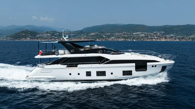 Chillin' Yacht Photos Pics Luxury Azimut Grande 27 METRI yacht cruising on open sea, 2020 model.