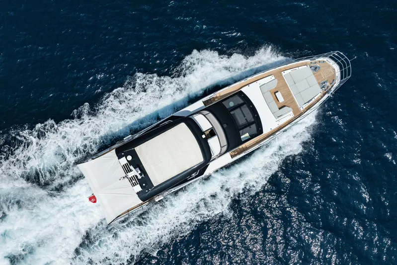 Chillin' Yacht Photos Pics Aerial view of 2020 Azimut Grande 27 METRI yacht cruising on the ocean.