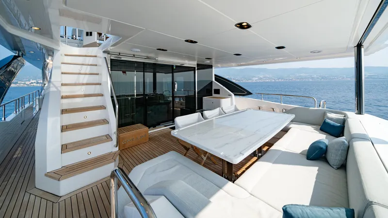 Chillin' Yacht Photos Pics Luxurious deck of 2020 Azimut Grande 27 METRI yacht with elegant seating and ocean view.
