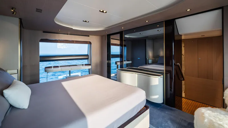 Chillin' Yacht Photos Pics Luxurious bedroom interior of 2020 Azimut Grande 27 METRI yacht with ocean view.