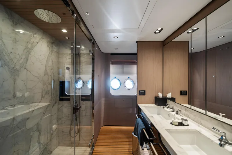 Chillin' Yacht Photos Pics Luxurious bathroom on 2020 Azimut Grande 27 METRI yacht with marble shower and dual sinks.