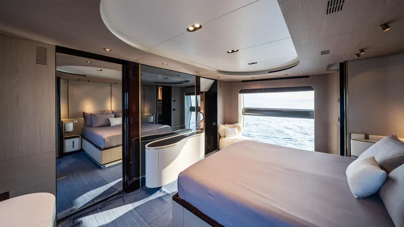 Chillin' Yacht Photos Pics Luxurious bedroom interior of 2020 Azimut Grande 27 METRI yacht with ocean view.