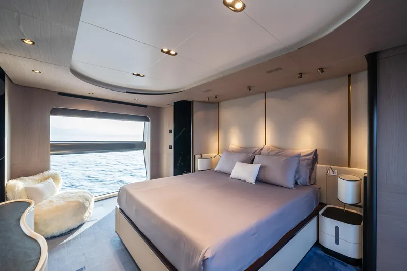Chillin' Yacht Photos Pics Luxurious bedroom interior on 2020 Azimut Grande 27 METRI yacht with ocean view.