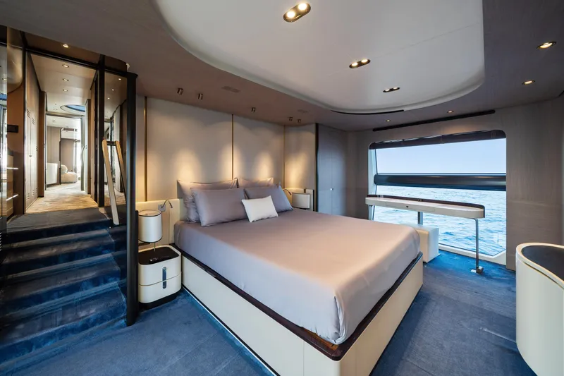 Chillin' Yacht Photos Pics Luxurious bedroom interior of 2020 Azimut Grande 27 METRI yacht with ocean view.