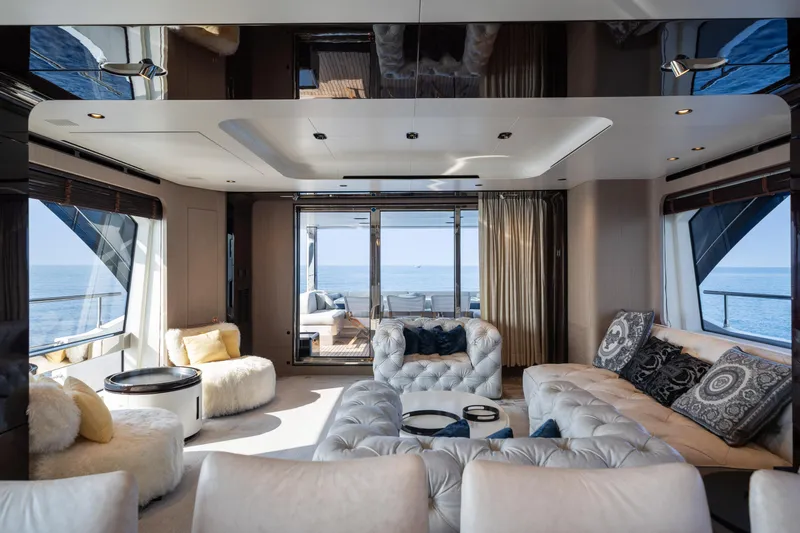 Chillin' Yacht Photos Pics Luxurious interior of 2020 Azimut Grande 27 METRI yacht with elegant seating and ocean view.
