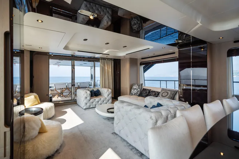 Chillin' Yacht Photos Pics Luxurious interior of 2020 Azimut Grande 27 METRI yacht with plush seating and ocean view.