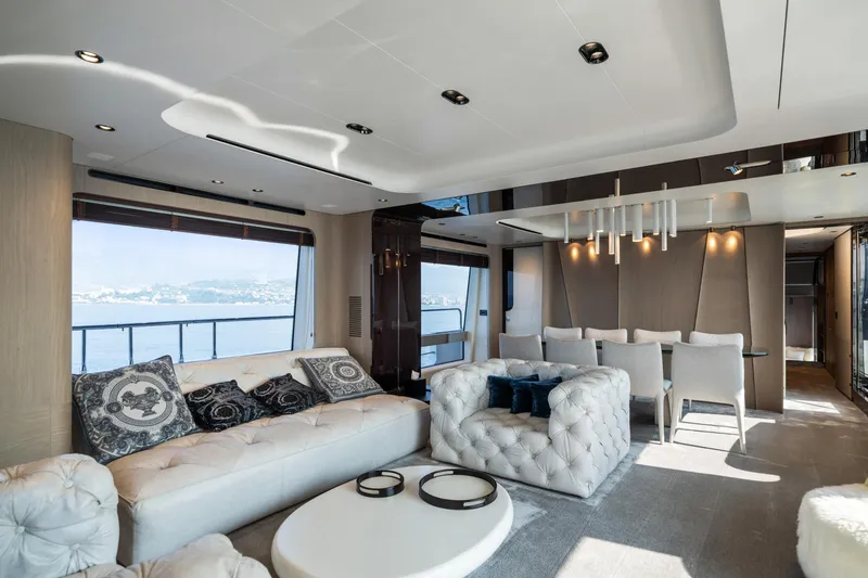 Chillin' Yacht Photos Pics Luxurious interior of 2020 Azimut Grande 27 METRI yacht with elegant seating and dining area.