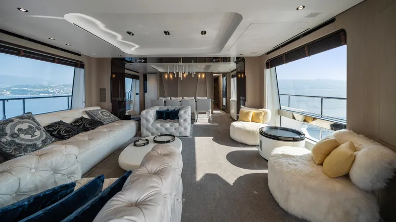 Chillin' Yacht Photos Pics Luxurious interior of 2020 Azimut Grande 27 METRI yacht with elegant seating and panoramic windows.