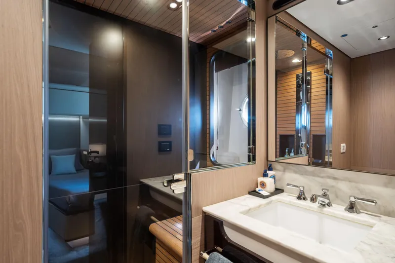 Chillin' Yacht Photos Pics Luxurious bathroom interior of 2020 Azimut Grande 27 METRI yacht, featuring modern fixtures and elegant design.