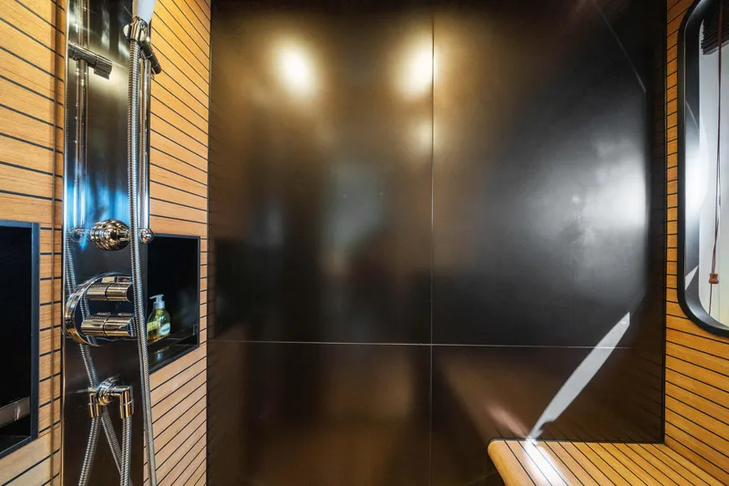 Chillin' Yacht Photos Pics Luxurious shower area in 2020 Azimut Grande 27 METRI yacht with modern fixtures.