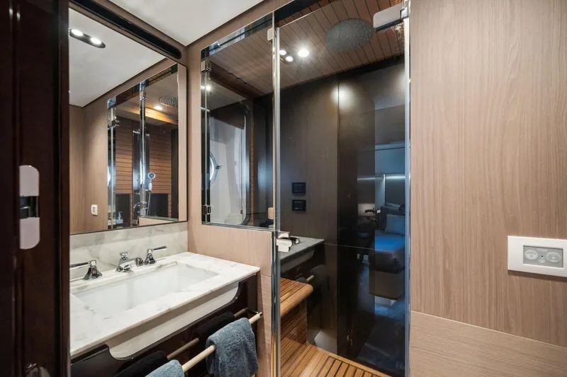 Chillin' Yacht Photos Pics Luxurious bathroom interior of 2020 Azimut Grande 27 METRI yacht with modern fixtures.