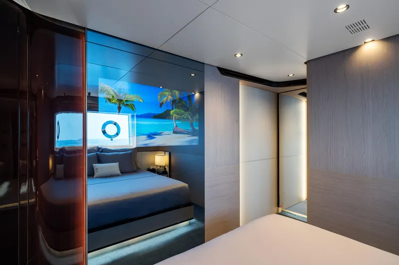 Chillin' Yacht Photos Pics Luxurious bedroom interior of 2020 Azimut Grande 27 METRI yacht with beach-themed decor.