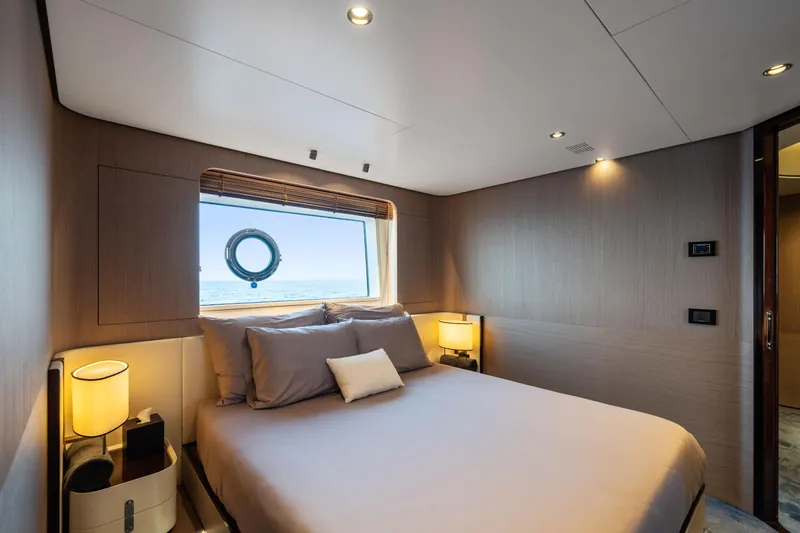 Chillin' Yacht Photos Pics Luxurious bedroom interior on 2020 Azimut Grande 27 METRI yacht with ocean view.