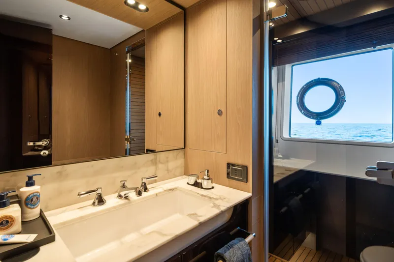 Chillin' Yacht Photos Pics Luxurious bathroom on 2020 Azimut Grande 27 METRI yacht with ocean view.