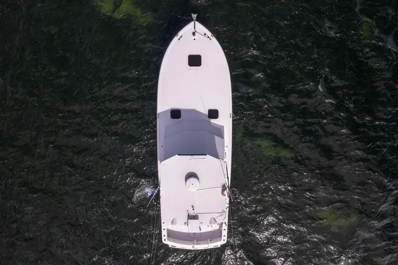  Yacht Photos Pics Aerial view of 1978 Hatteras 42 Convertible boat on dark water.