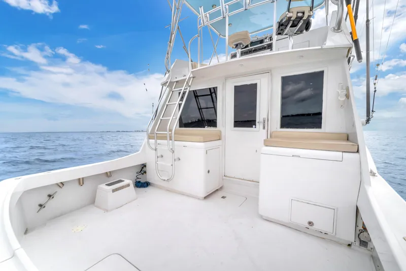  Yacht Photos Pics 1978 Hatteras 42 Convertible yacht deck with ocean view and clear sky.