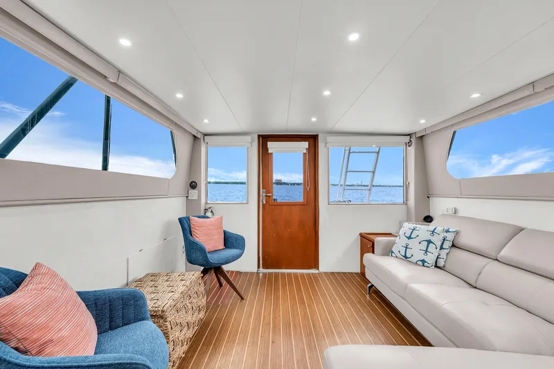  Yacht Photos Pics Interior of 1978 Hatteras 42 Convertible yacht with modern seating and ocean view.