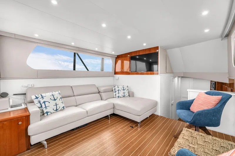  Yacht Photos Pics Luxurious interior of 1978 Hatteras 42 Convertible yacht with modern seating and decor.