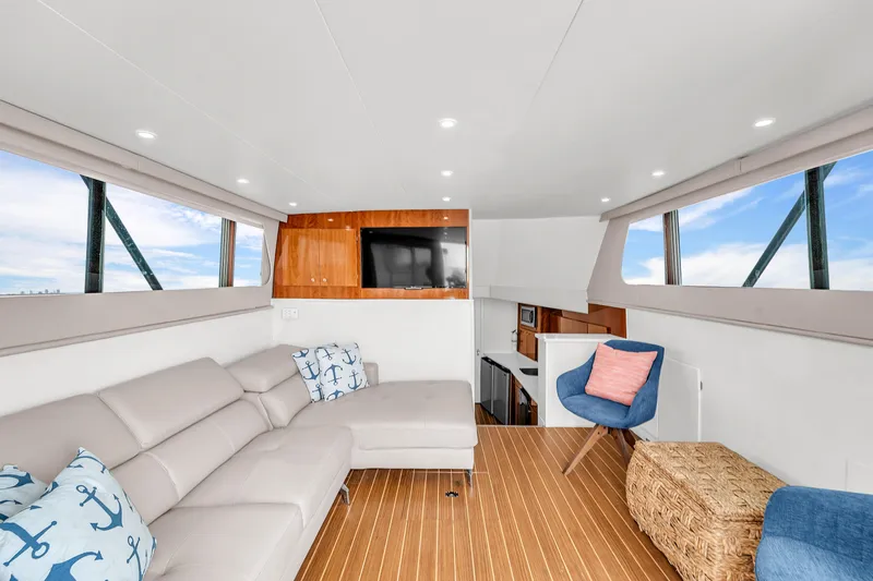  Yacht Photos Pics Interior of 1978 Hatteras 42 Convertible yacht with modern furnishings and wood flooring.