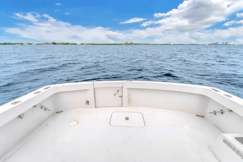  Yacht Photos Pics 1978 Hatteras 42 Convertible boat deck with ocean view under blue sky.