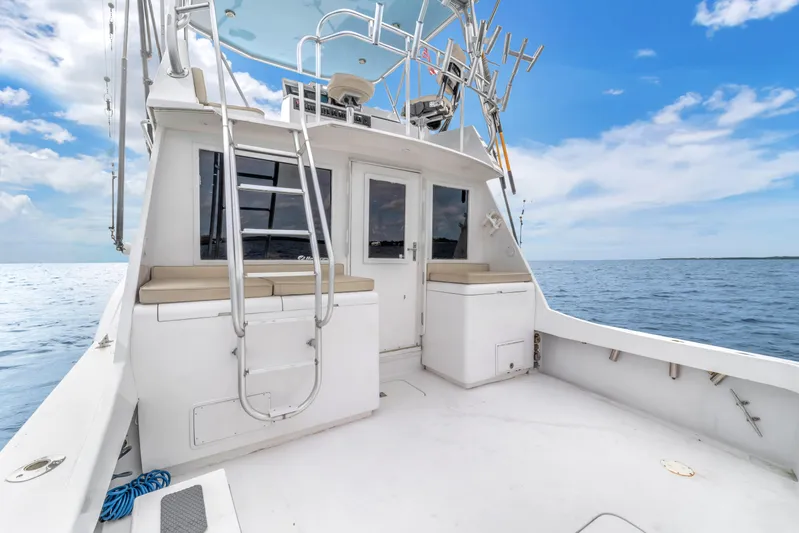  Yacht Photos Pics 1978 Hatteras 42 Convertible boat deck with ocean view and clear sky.