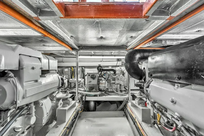  Yacht Photos Pics Engine room of 1978 Hatteras 42 Convertible yacht, showcasing dual engines and mechanical components.