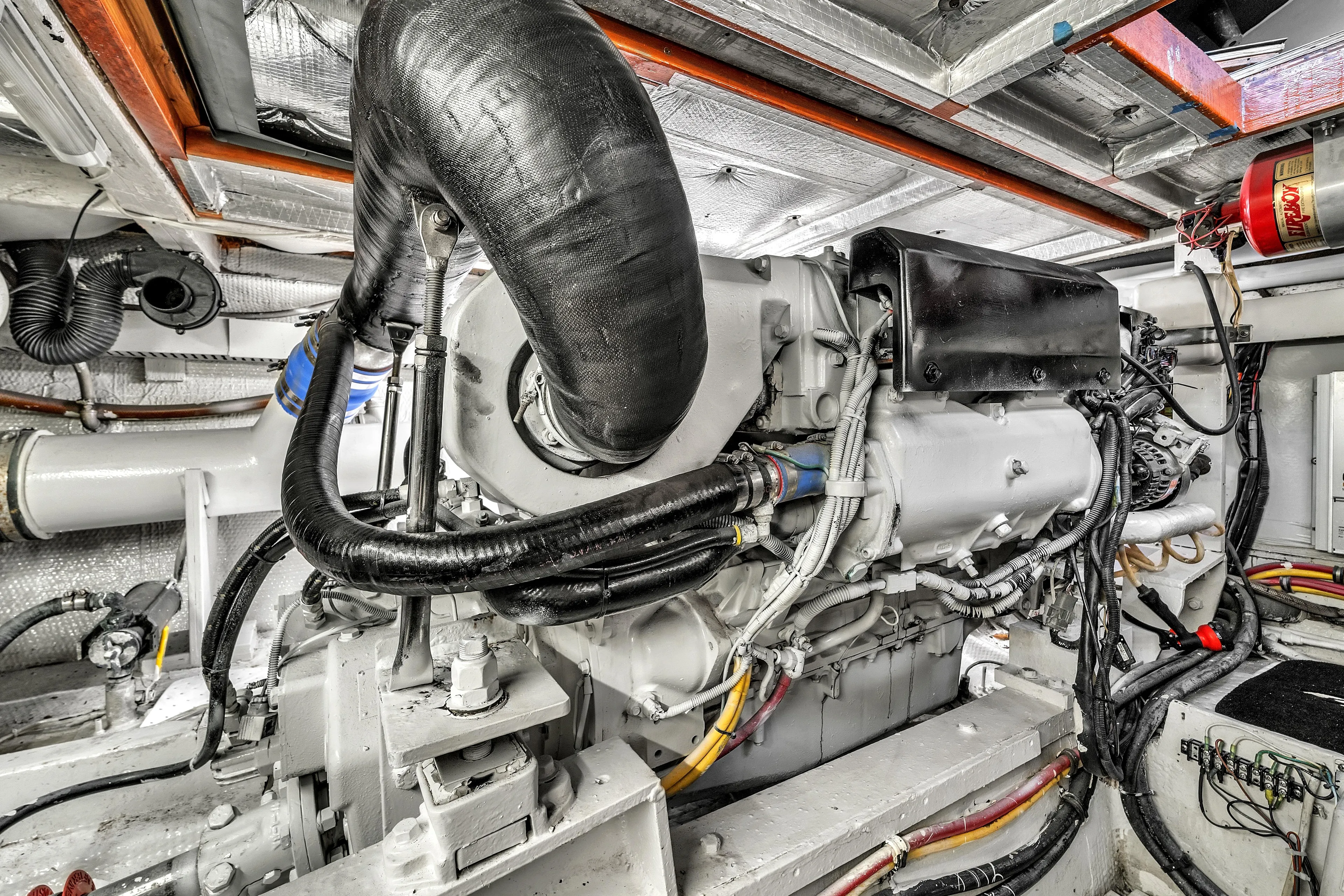  Yacht Photos Pics Engine room of a 1978 Hatteras 42 Convertible yacht, showcasing detailed machinery.