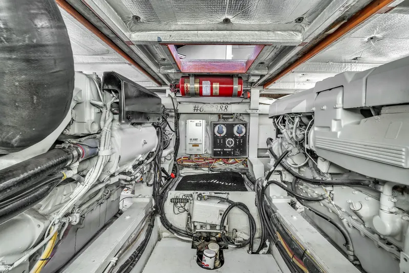  Yacht Photos Pics Engine room of 1978 Hatteras 42 Convertible yacht, showcasing mechanical components and wiring.