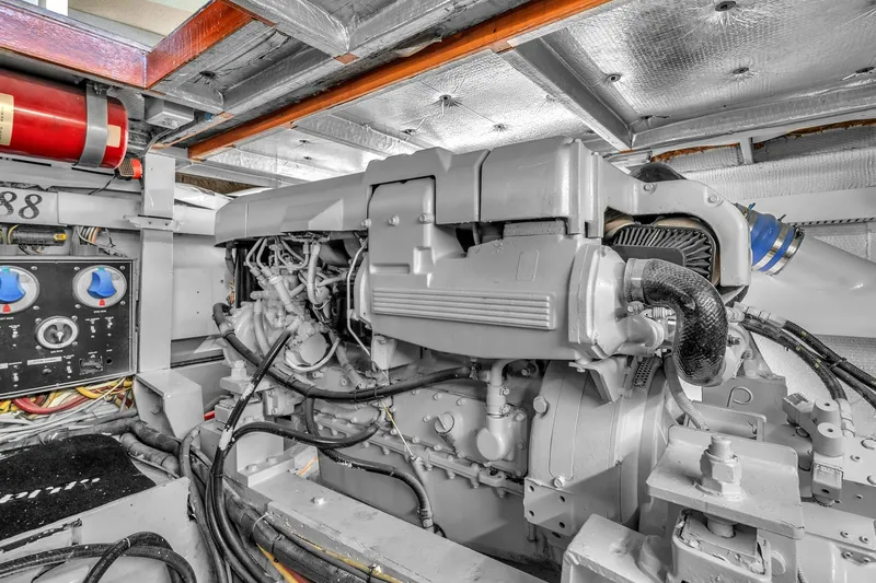  Yacht Photos Pics Engine room of a 1978 Hatteras 42 Convertible yacht, showcasing machinery and controls.