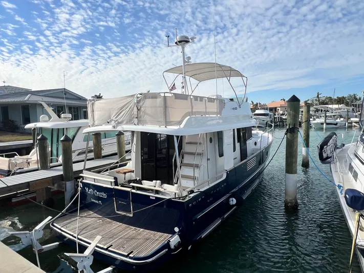  Yacht Photos Pics 2019 Beneteau Swift Trawler 44 docked at marina under blue sky.