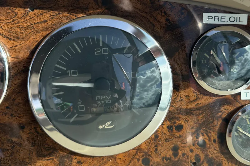  Yacht Photos Pics Close-up of 1999 Sea Ray 410 Express Cruiser dashboard gauges, featuring RPM and oil pressure indicators.