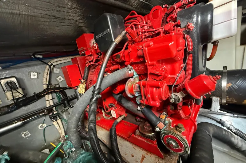  Yacht Photos Pics Engine compartment of a 1999 Sea Ray 410 Express Cruiser with red engine components.