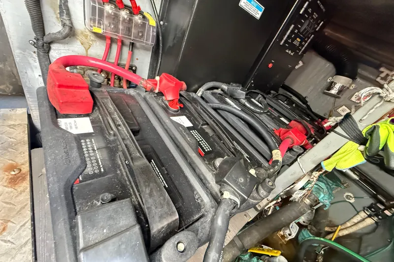  Yacht Photos Pics Battery compartment of a 1999 Sea Ray 410 Express Cruiser with cables and connections.