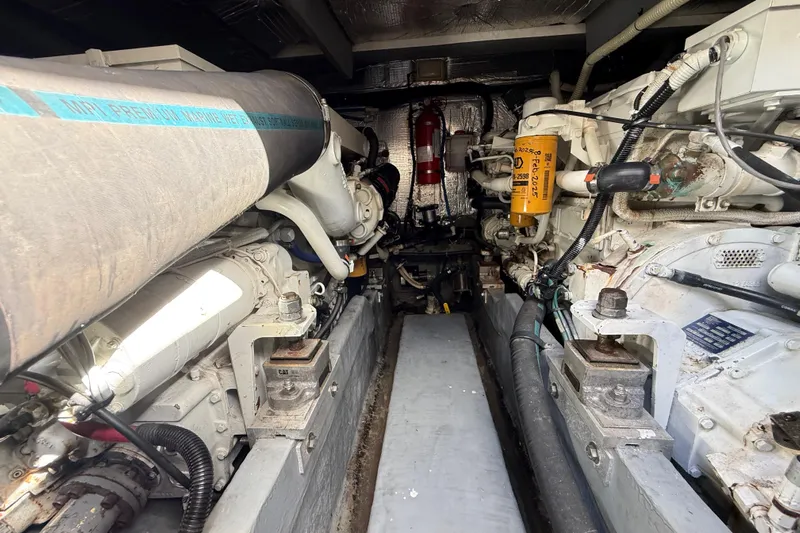  Yacht Photos Pics Engine room of a 1999 Sea Ray 410 Express Cruiser, showcasing mechanical components.