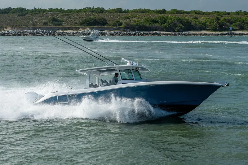 Tingum Yacht Photos Pics 2021 HCB 42 Lujo boat cruising on open water.