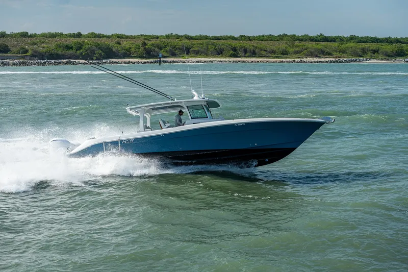 Tingum Yacht Photos Pics 2021 HCB 42 Lujo boat cruising on open water.