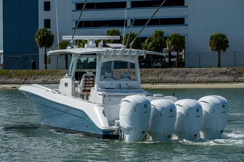 Tingum Yacht Photos Pics 2021 HCB 42 Lujo boat with four outboard engines on the water.