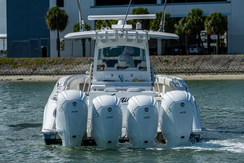 Tingum Yacht Photos Pics 2021 HCB 42 Lujo boat with four powerful outboard engines on the water.