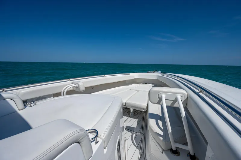 Tingum Yacht Photos Pics 2021 HCB 42 Lujo boat with white seating on open water.