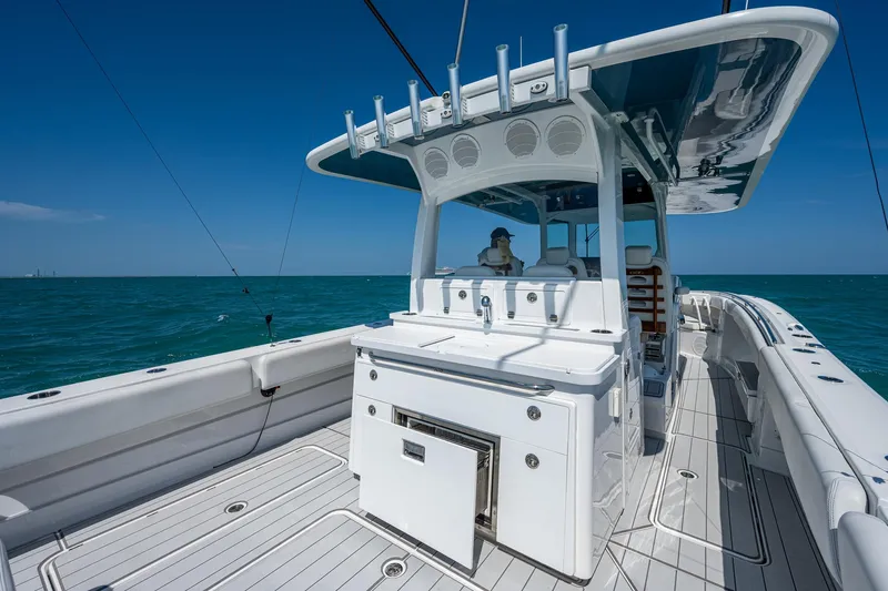 Tingum Yacht Photos Pics 2021 HCB 42 Lujo boat interior with fishing rod holders and ocean view.