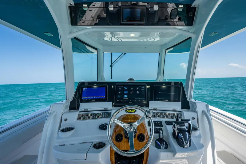 Tingum Yacht Photos Pics 2021 HCB 42 Lujo boat helm with advanced navigation systems and ocean view.