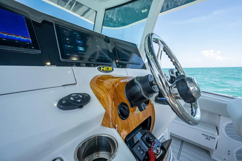 Tingum Yacht Photos Pics 2021 HCB 42 Lujo boat helm with modern controls and ocean view.