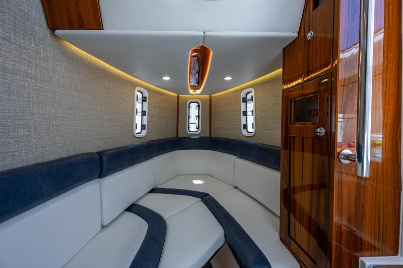Tingum Yacht Photos Pics Luxurious interior cabin of 2021 HCB 42 Lujo boat with modern seating and wood finishes.