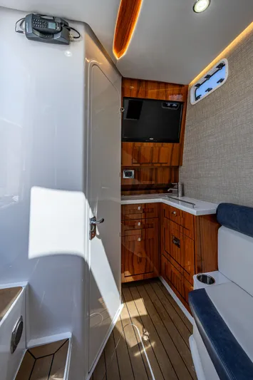 Tingum Yacht Photos Pics Interior of 2021 HCB 42 Lujo boat with wooden cabinetry and seating.
